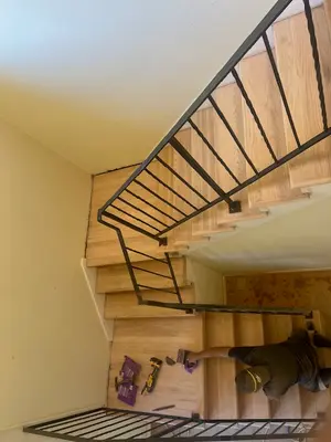 Indoor Hardwood Staircase with Custom Iron Railing
