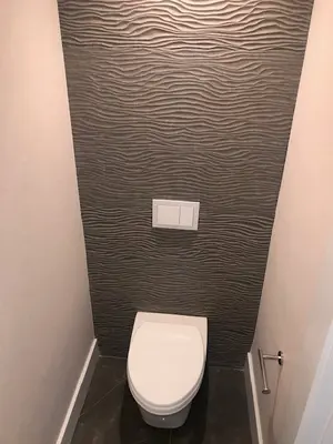 Bathroom Remodel with Textured Accent Wall and Floating Toilet